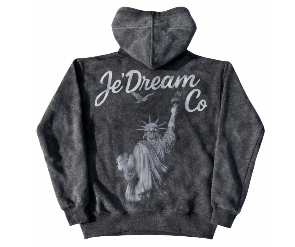 Black acid wash hoodie with 'Je'Dream Co' branding and Statue of Liberty graphic on a white background