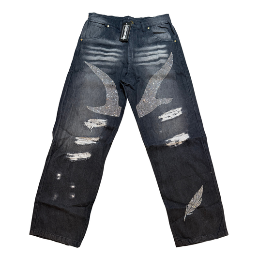 Distressed black jeans with bird and feather design with rhinestones on a white background