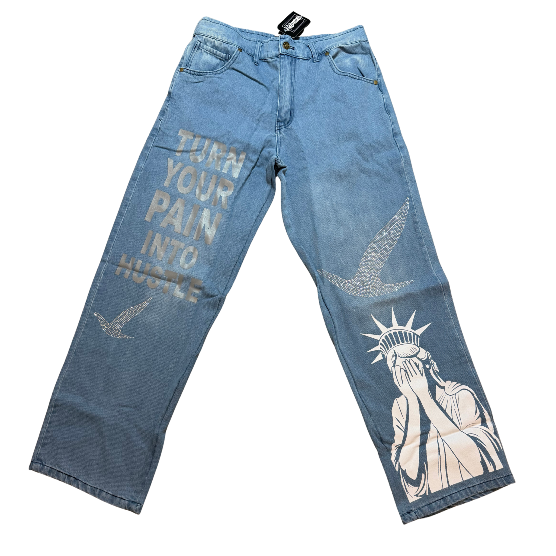 Blue denim jeans with graphic designs Statue of Liberty and birds in rhinestones and a white background
