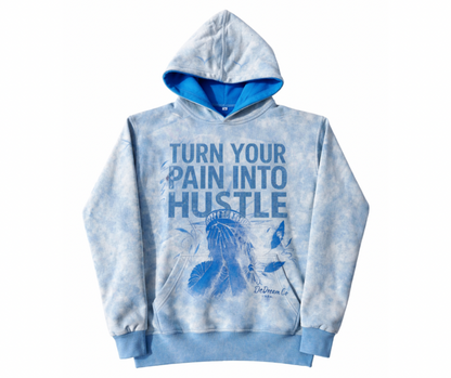Light Blue acid wash hoodie with text 'Turn Your Pain Into Hustle' in rhinestones on a white background