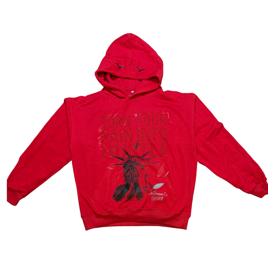Front of Red hoodie with red rhinestones and Statue of Liberty face graphic design on a white background