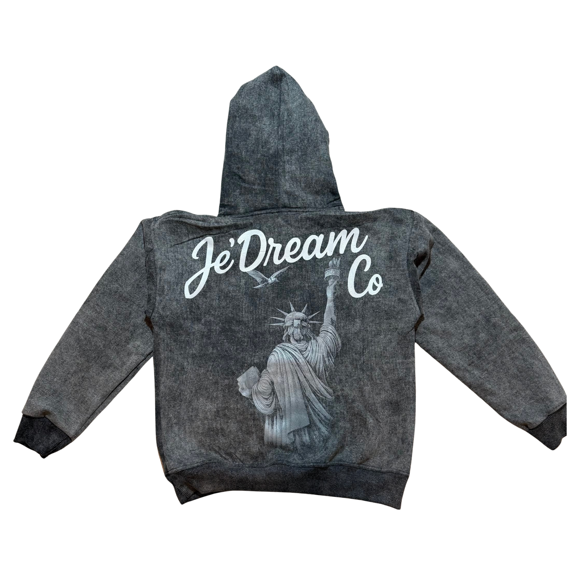 Black acid wash hoodie with je’ dream co on back and back view of Statue of Liberty in white background 