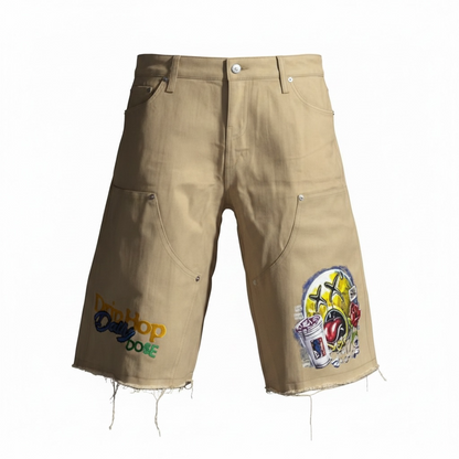 Love Hurts Drip Heals tan denim jorts by Je’ Dream Co, featuring streetwear graphic design, relaxed fit, premium denim fabric, and bold motivational branding for summer urban fashion style  on a white background