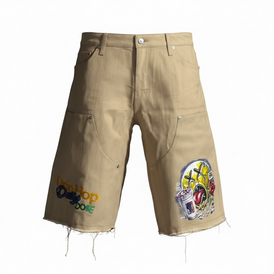 Love Hurts Drip Heals tan denim jorts by Je’ Dream Co, featuring streetwear graphic design, relaxed fit, premium denim fabric, and bold motivational branding for summer urban fashion style  on a white background
